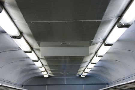 Rows of lamps on electric train ceilingの写真素材