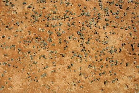 Patten wall from small stones of one of many-storeyed houses of northern cityの写真素材