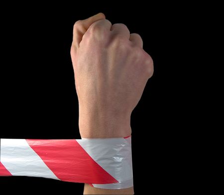 Fist and protecting tape on a black background