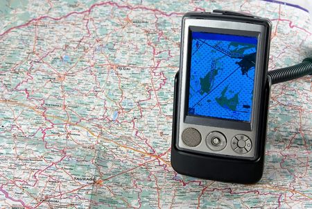 Ppc with function of the navigator close up against a mapの写真素材