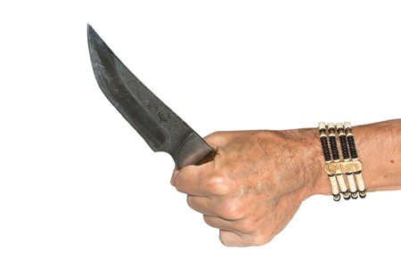 The criminal with a knife in handsの写真素材