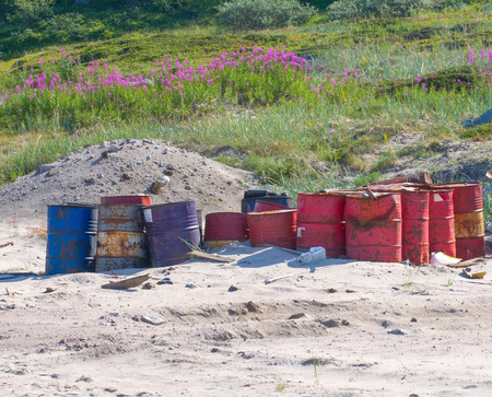 barrels fuel gas station on sand pollution