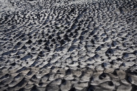 Black snow. Direct allegory of human pollution of the Earth. Concept of combining opposite. Backgroundの写真素材