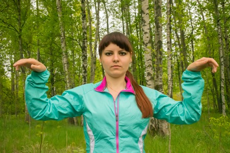 moments sports activities in wild nature Park. rotation of the brushes stretchingの写真素材