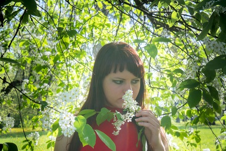 Beautiful Spring Girl with flowers. petals bloom girl happy
