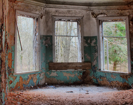 very old dilapidated dangerously unstable crumbling houseの写真素材