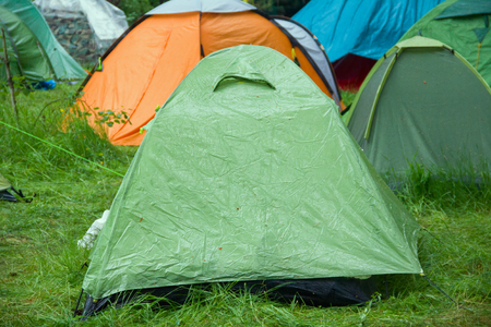 tent camp in forest after rainの写真素材