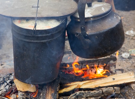 soup on camping fire. food in pot in recreationの写真素材