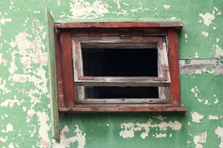 window in abandoned house broken. building where there are no peopleの写真素材