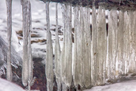frozen coast sea in winter. everything was covered with ice backgroundの写真素材