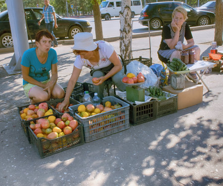 Kazakhstan, Pavlodar - July 24, 2016: street trading poor retired grandmother in hot sunのeditorial素材