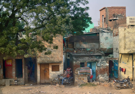 India, Delhi - Dec 28, 2015: Typical home stay of not very rich Indians, mix of villages and towns, Megapolis Delhi (outskirts)のeditorial素材