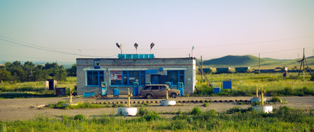 Kazakhstan , Semei - August 10, 2016: Old filling station, fuel station, gas station on secondary provincial road, car of eightiesのeditorial素材
