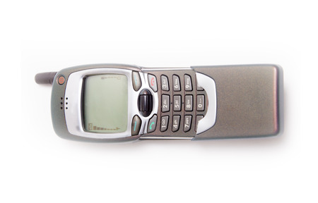 Old Mobile Phone. disposed obsolete phone on white backgroundの写真素材