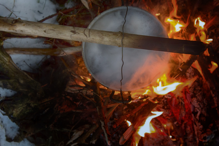 picnic in winter on nature of a bonfire. cooking in the campaignの写真素材