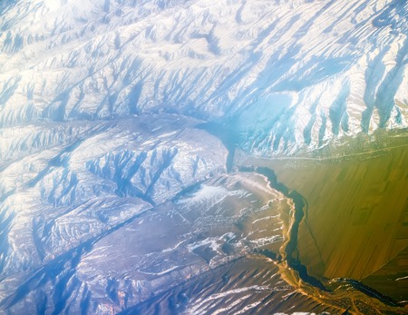 Flight over Pamir and Tien Shan 5. Visible deep mountain valley and multitude of parallel ridges.