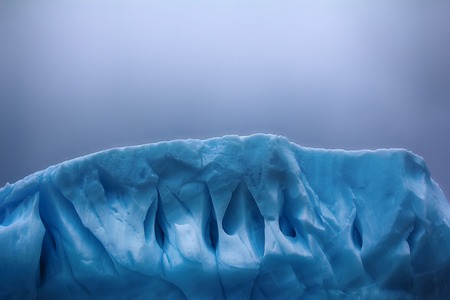 Iceberg fanciful shapes - slick hurricane-force winds and storm waves, blue fresh ice. Franz-Joseph...