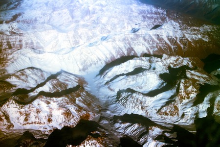 Bright spring of grief with the bird's eye - brilliant snow-capped peaks, deep gorges and glaciersの写真素材