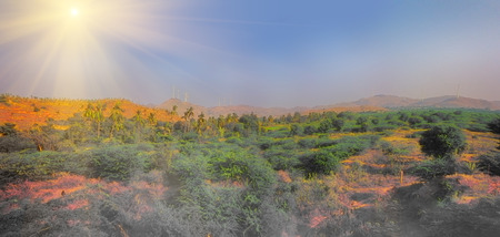 Alternative energy sources 7. Wind farm in Indian province of Kerala. Many wind-powered generators stand opposite to mountainous terrainの写真素材