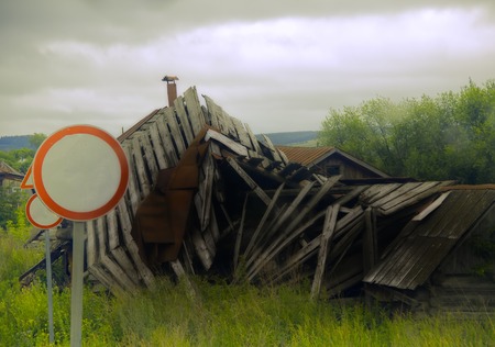 abandoned old house collapsed from extreme weather eventsの写真素材