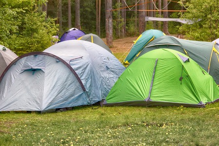 camping outdoor with tent in woods in summerの写真素材