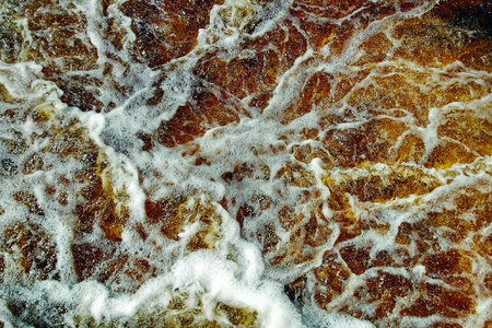 river splashes background, reddish spring water full of energyの写真素材