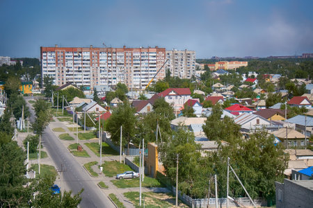Kazakhstan, Pavlodar - July 24, 2016: City Pavlodar in Northern Kazakhstan 2016. Sector of private houses and apartment buildings quarter. Main area of development of virgin lands (steppe) in USSR in mid 20th centuryのeditorial素材