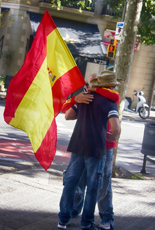 Spain, Catalonia, Barcelona - 8 October 2017: people with national symbols and flags on streetsのeditorial素材