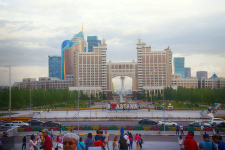 Astana, Kazakhstan - July 17, 2016: Walk around city with camera on button - exit to square with skyscrapers, lot of folks. New capital of Kazakhstan city Astana.のeditorial素材