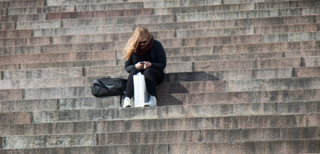 Helsinki , Finland - August 22, 2017: Cathedral Of St. Nicholas, tourists rest on steps of monumental building attractionsのeditorial素材