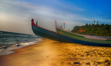 Painted and carving boats of Indian fishermen on beaches of Kerala. Love attitude to work and life (Indian civilization)の写真素材
