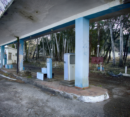 Old abandoned filling station, fuel station, gas station on secondary provincial road, fuel dispenser brokenの写真素材