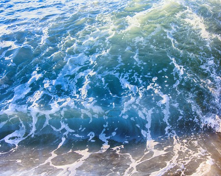 Sea waves during a storm. water boils at shore a force of nature