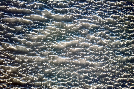 sea ice background close-up. small pellets of snow among ice