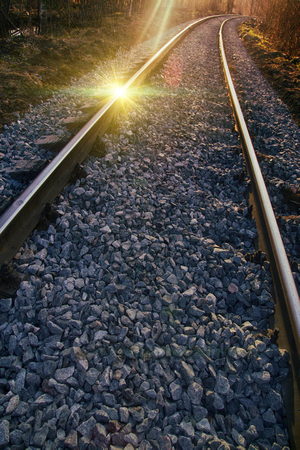 Good frame for advertising of railway (advertising of freight). Setting sun and reflection on rails. photo contourの写真素材