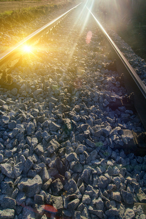Railway and reflections of the sun on the rails. photo contourの写真素材