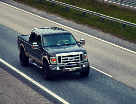 Helsinki surroundings, Finland - August 20, 2017: Ford truck SUV f 450 on the highway, Top view side...