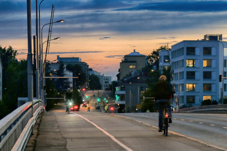 HELSINKI, FINLAND - AUGUST 22, 2017: Cycling in evening cityのeditorial素材