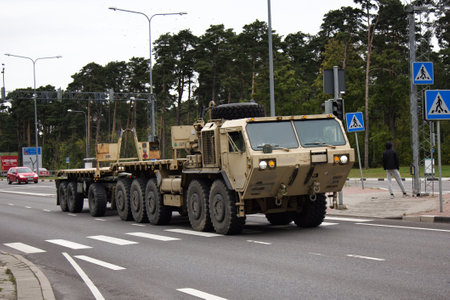 Parnu, Estonia - September 4, 2017: Army equipment (military machinery, army transport) on highway. Tractor old model, rocket tractor, Soviet army, army transportation unitのeditorial素材