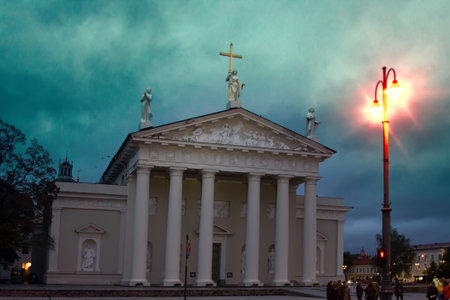 Lithuania, Vilnius - September 5, 2017: Cathedral square, Cathedral of St. Stanislaus like Greek temple (naos) . Artistic composition with burning lantern. Roman Catholic Cathedral, architecture of classicism.のeditorial素材