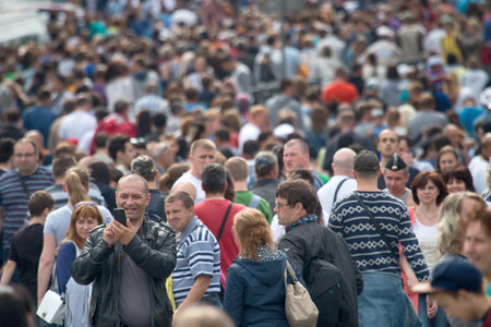 Saint Petersburg, Russia - July 30, 2017: Huge crowd of people during holiday, city festivals, urban entertainment, townspeople gathered on historic street, mob stormed through streetsのeditorial素材
