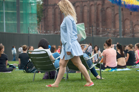 Saint Petersburg, Russia - July 30, 2017: yoga festival on lawn in Park in center of metropolis. Summer holiday of sport and healthのeditorial素材