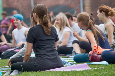 Saint Petersburg, Russia - July 30, 2017: yoga festival on lawn in Park in center of metropolis. Summer holiday of sport and healthのeditorial素材