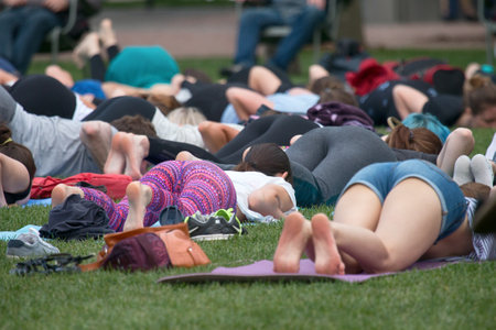 Saint Petersburg, Russia - July 30, 2017: yoga festival on lawn in Park in center of metropolis. Summer holiday of sport and healthのeditorial素材