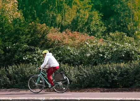 HELSINKI, FINLAND - AUGUST 22, 2017: Bike ride in Park. Cyclist on background of nature, cycle lane; criterium roadのeditorial素材