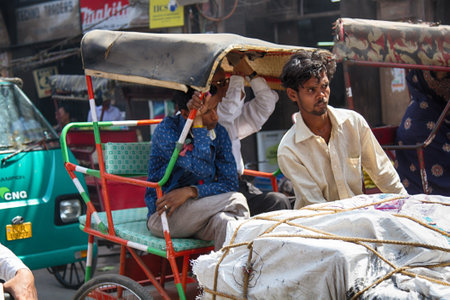 India, new Delhi - March 19, 2018: taxi rickshaw with a passenger. it is a Bicycle transport without motor and fuelのeditorial素材