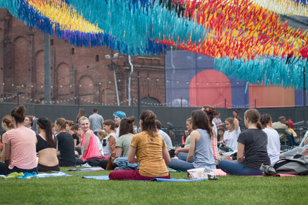 Saint Petersburg, Russia - July 30, 2017: yoga festival on lawn in Park in center of metropolis. Summer holiday of sport and healthのeditorial素材