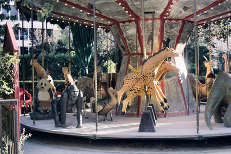 Paris, France - September 22, 2017: Classic carousel with animals in amusement Park. But other characters-dinosaurs, gorillas, dodos, pandas waiting for new educated childrenのeditorial素材