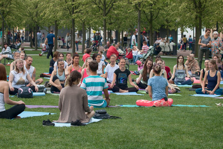 Saint Petersburg, Russia - July 30, 2017: yoga festival on lawn in Park in center of metropolis. Summer holiday of sport and healthのeditorial素材