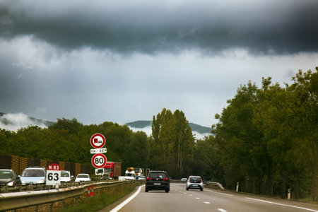 Colmar, France - September 19, 2017: Highway is in foothills, covered with fog and low clouds. Change in weatherのeditorial素材